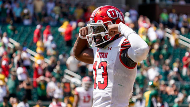 Sep 9, 2023; Waco, Texas, USA; Utah Utes quarterback Nate Johnson (13) carries the ball for a 11-yard touchdown against the Baylor Bears during the second half at McLane Stadium. Mandatory Credit: Raymond Carlin III-USA TODAY Sports